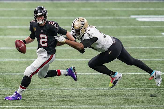 Dec 6, 2020; Atlanta Falcons quarterback Matt Ryan (2) runs to escape a sack from New Orleans Saints defensive end Cameron Jordan (94). Mandatory Credit: Dale Zanine-USA TODAY Sports
